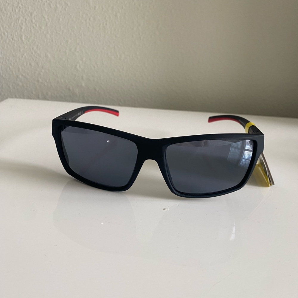 Foster Grant iron man Black Swim Sunglasses with Red Temple Tips